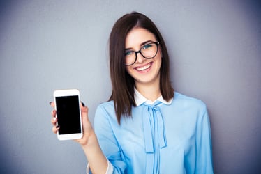 woman holding refurbished mobile phone