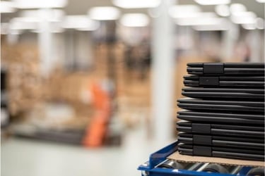 Stack of refurbished laptops ready for reuse 