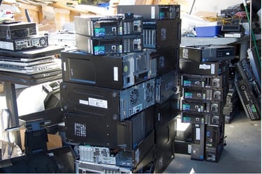 stacks of electronic e-waste headed for landfill