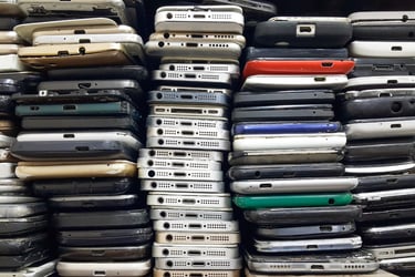 stack of outdated cellphones