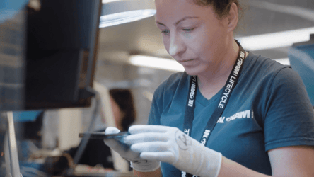 returns management technician assesses phone