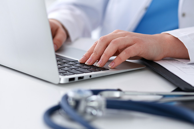 Healthcare worker on laptop